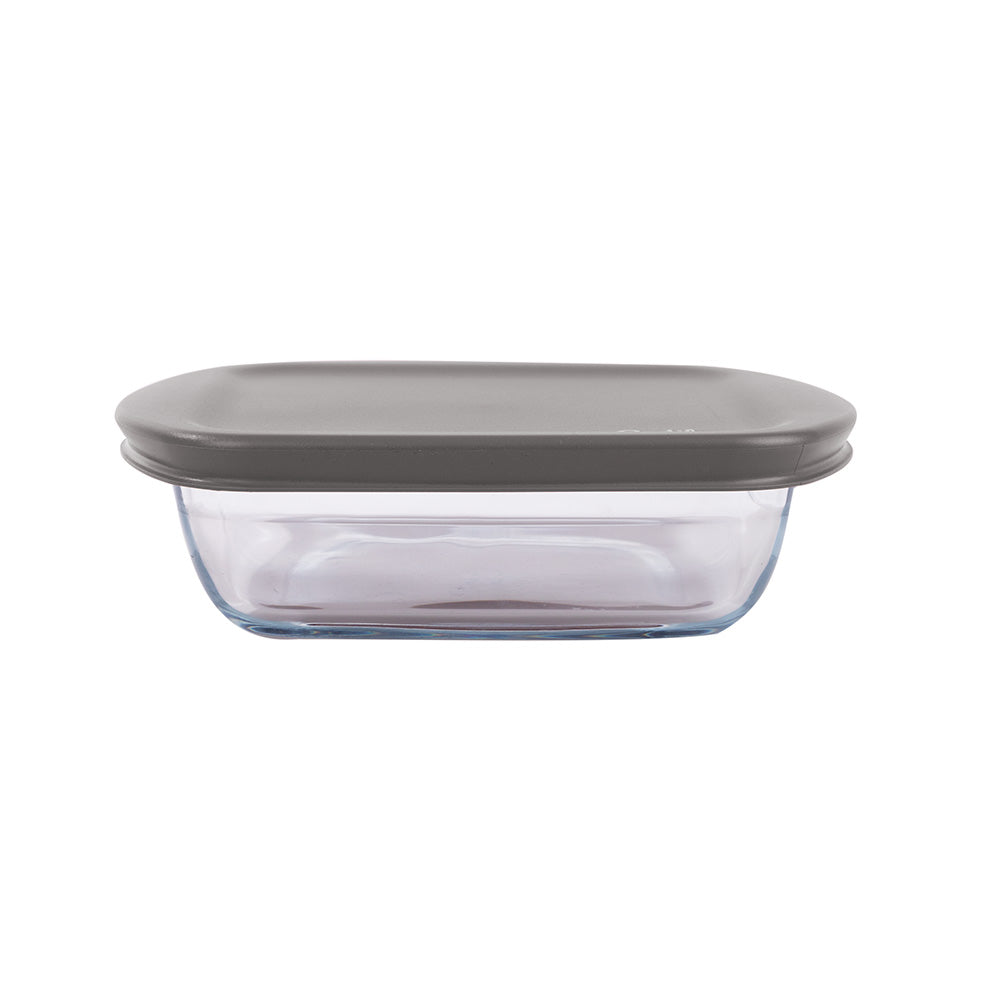 Recipiente para alimentos em vidro (Pyrex) com base em vidro e tampa em plástico flexivel cinzenta. Foto em fundo branco